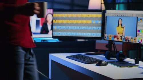 Man Editing Video at Computer Workstation