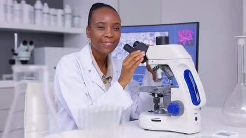 Scientist Using Microscope in Modern Laboratory