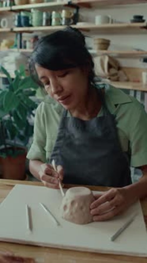 Woman Shaping Clay for Pottery Project Indoors
