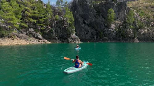 Aerial View Summer Paddleboard Adventure in the Green Canyon People Swimming and Relaxing