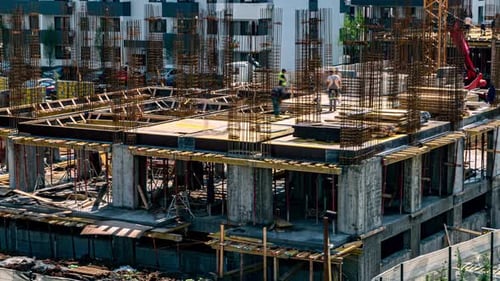 Construction Workers Building Skyscraper in the City