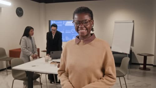 Young Black Business Professional Posing in Modern Office