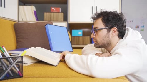 Disciplined and happy man reading a book.
