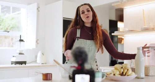 Woman Cooking and Presenting Recipe in Kitchen