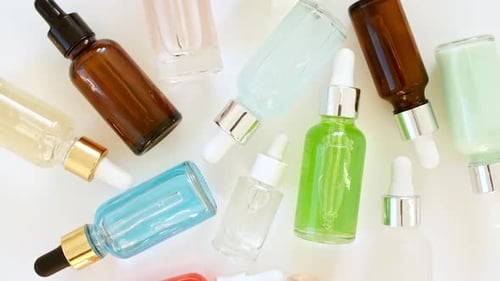 Colorful Skincare Serum and Oil Bottles with Droppers