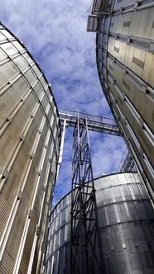 Grain Silos Against Blue Sky