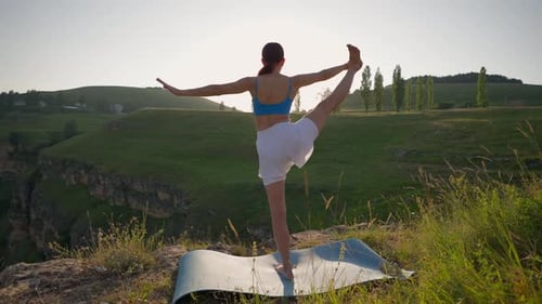 Young Athletic Woman Meditating on Top Mountain Zen Yoga Outdoors