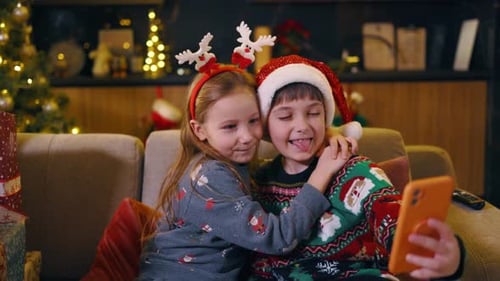 Festive Children Taking Selfie on Christmas Morning
