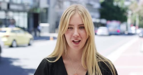 4k video footage of a young woman being interviewed about her internet speed on the street