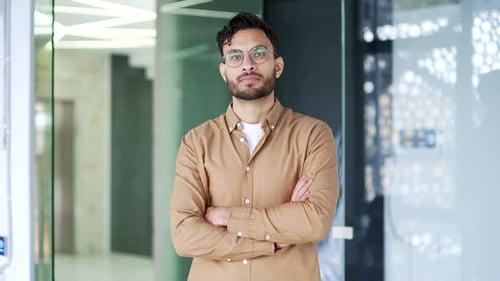 Confident Young Professional Man Portrait in Modern Office