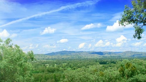 Green hills and blue sky a timelapse of a beautiful rural landscape