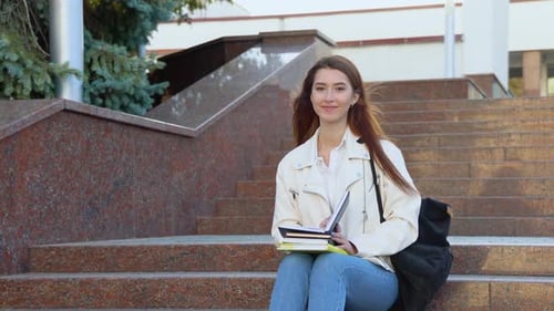 Young Woman Student Studying on Urban Campus Steps
