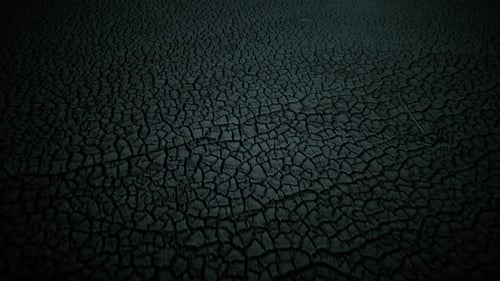 Cracked Dry Ground Aerial in Dark Lighting
