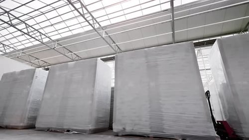 Industrial Warehouse Boxes Crate Wrapped Cellophane Package for Delivery Tracking Shot