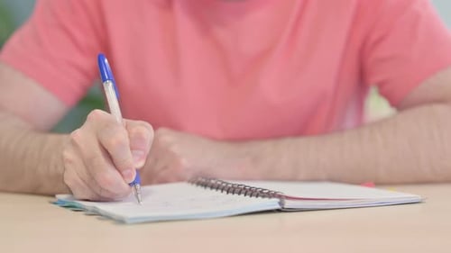 Close up of Man Writing