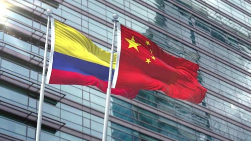 Colombian and Chinese Flags Waving in Corporate Setting