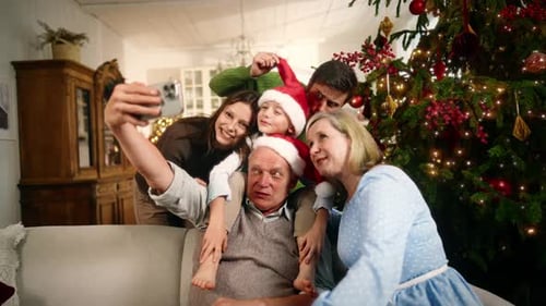 Family Christmas Photo Together by the Tree
