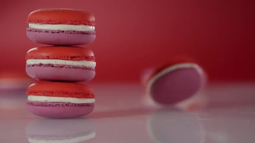 Colorful Stack of Macarons on Red Background