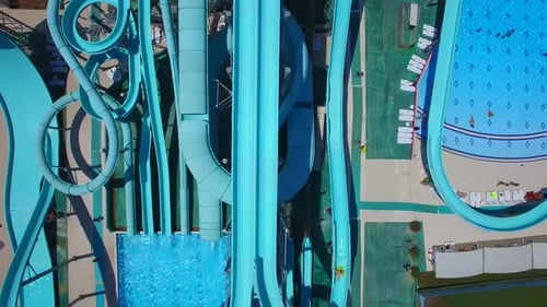 Aerial view of people sliding down a water slide at a water park