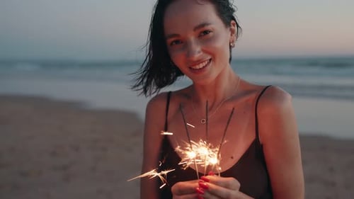 Woman Alone Celebrating on the Beach