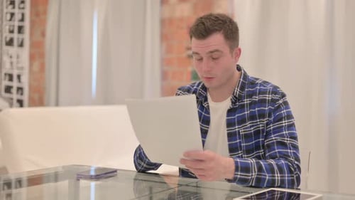 Man Reading Good News With Excitement