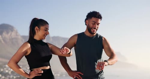 Athletic Couple Talking after Workout Outdoors in Sunlight