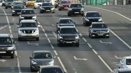 Evening rush hour traffic flowing smoothly on a moscow Russia highway