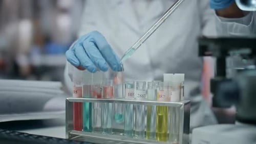 Lab Worker Filling Test Tube with Experimental Drug Making Research Close Up
