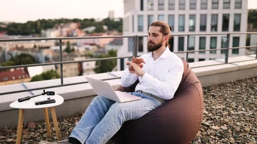 Young Adult on Laptop Having a Video Call
