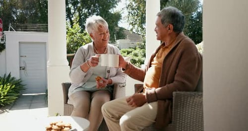 Senior Couple Relaxing and Chatting on Porch