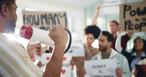 Passionate Group Protests with Signs and Bullhorn