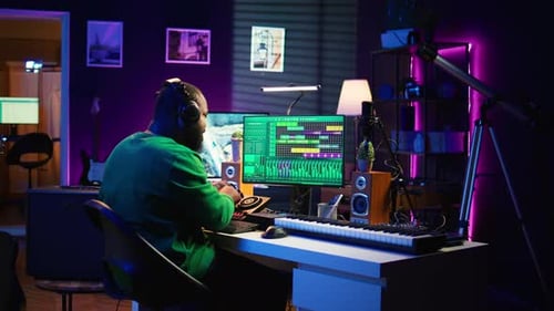 Confident Music Composer Mixing Sounds on Digital Audio Software
