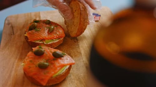 Open Face Salmon Sandwiches on Wooden Board