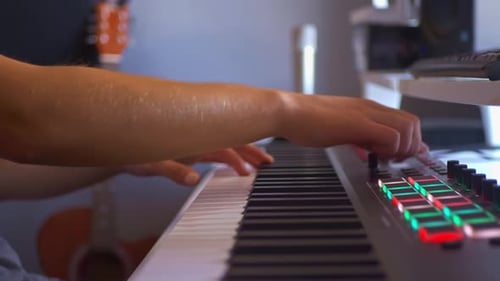 Musician Playing Electronic Keyboard in Studio