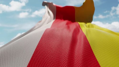 Waving Flag of South Ossetia Against Blue Sky
