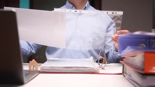 Office Worker Showing Blank Document Inside Plastic Sleeve