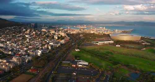 A Drone Flies Over a Modern and Beautiful South African City at Sunset