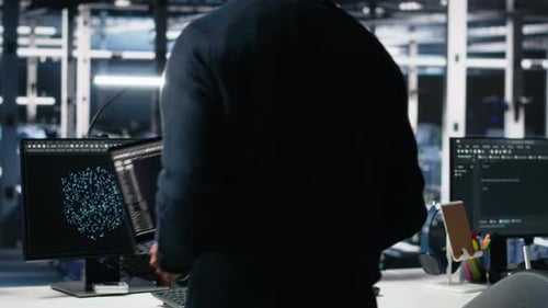 Admin Entering Data Center Office Reviews AI Diagnostics on Computer