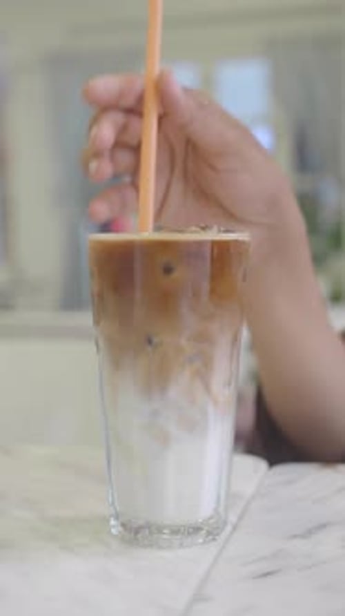 Iced Coffee Swirling in Clear Glass