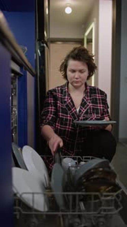 Woman Uses Dishwasher for Clean Dishes