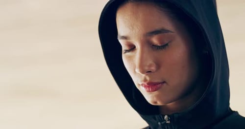 Woman in Hoodie Opens Her Eyes