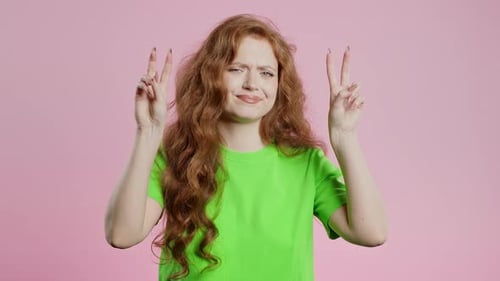 Woman With Red Hair Posing With Peace Sign