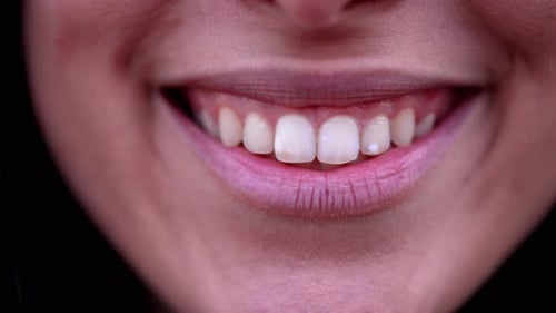 Happy woman lips smiling macro close up detail. Female Person mouth and lip in wide smile