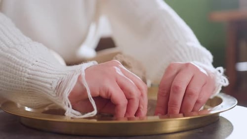 Mindful Guest Molding Octopus Shape in Tray During Therapy Session