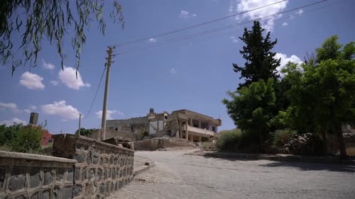 Damaged Building on a Hillside on a Sunny Day