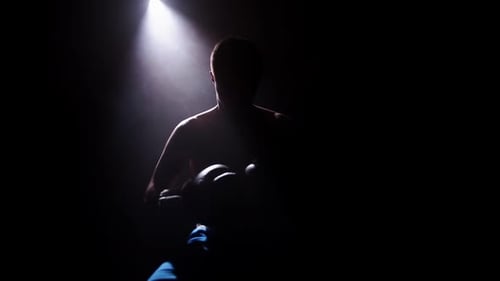 Unrecognizable Topless White Man in Blue Trousers and Black Boxing Gloves Ready for a Serious Fight