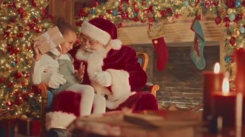Child Receives Christmas Gift From Santa Claus
