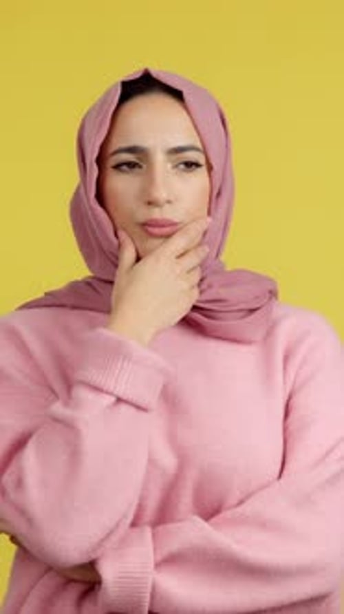 Woman in Headscarf Posing Thoughtfully