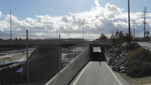 Child Runs Toward Tunnel in Urban Area