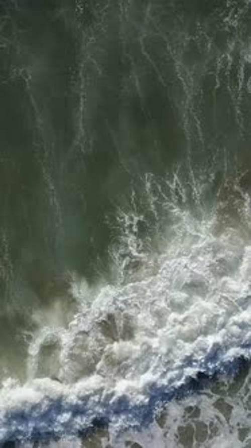 Vertical Video of Ocean Waves Rolling On Shoreline